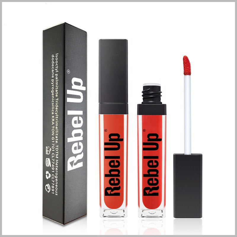 Red lip gloss with applicator and packaging labeled 'Rebel Up' on a white background